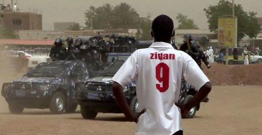 Sudan Troops in Jeeps Watched by Man Narrow