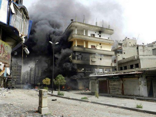 Syria Smoke Burning Near Buildings Homs