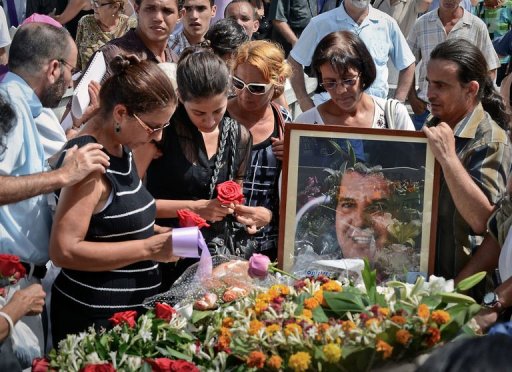 Cuba dissident's death Funeral w Portrait Family