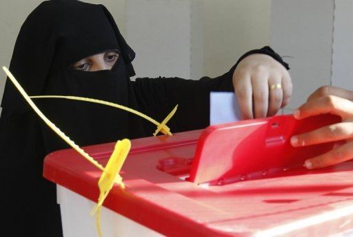 Danger from Libya Constitution woman casts vote