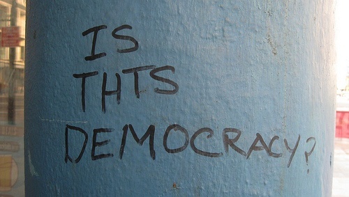 Is this democracy? written with pen on column
