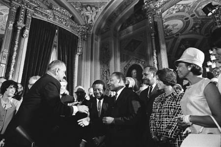 President Johnson, Martin Luther King, Jr. and Rosa Parks at the signing of the Voting Rights Act on August 6, 1965.